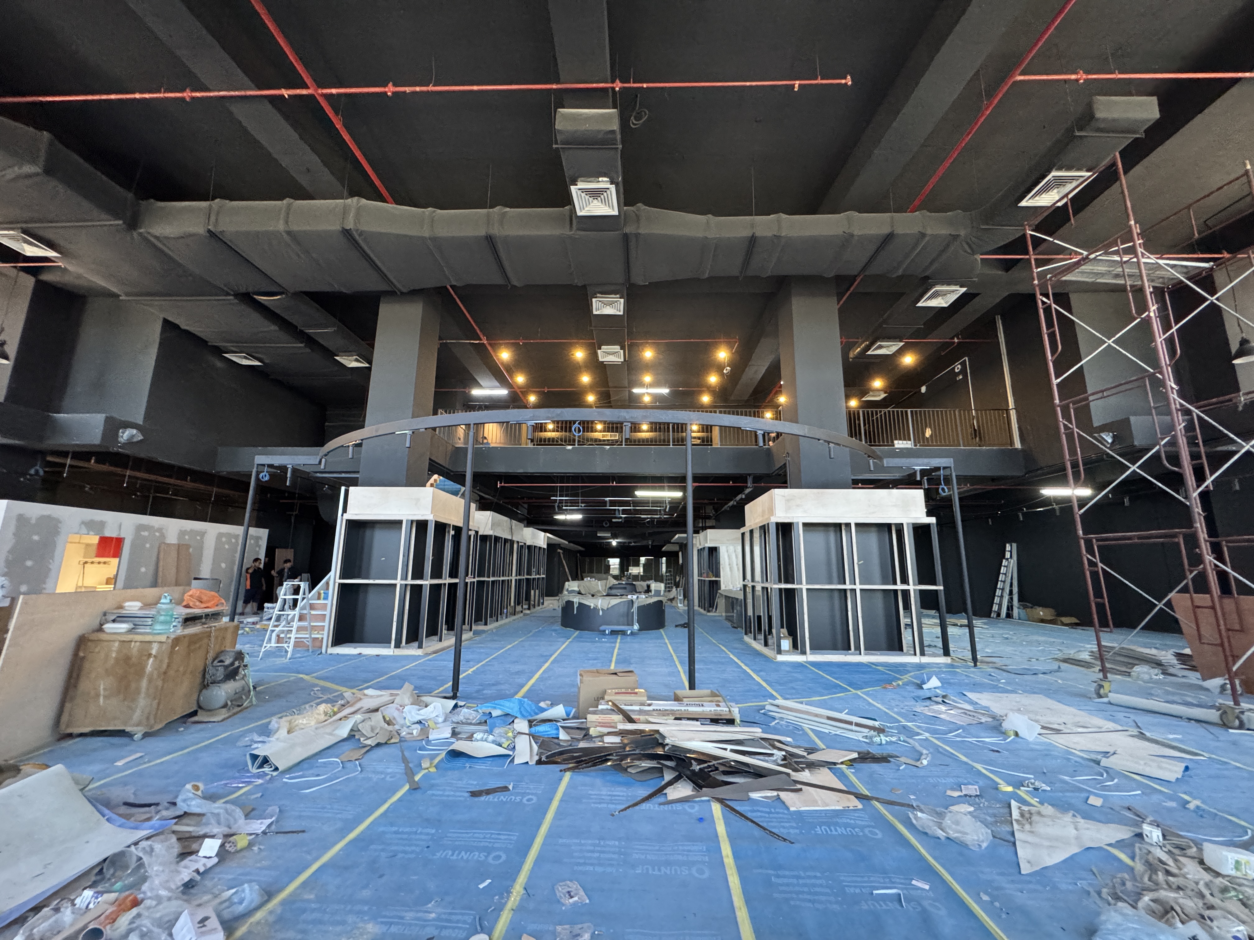 A wide view of the CAW Concept Store interior taking shape under construction